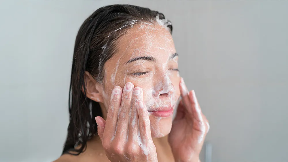 washing face with soap